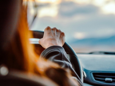 Person behind the wheel of a car